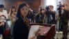 Legislator Eunice Yung, daughter-in-law of Elmer Yuen, one of the eight overseas activists wanted by the police, speaks to the media after being taken to the police station for investigation in Hong Kong, China, July 24, 2023. 