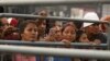 Friends and family members of inmates wait to hear news about their loved ones after deadly clashes at the Litoral Penitentiary, in Guayaquil, Ecuador, July 25, 2023. 