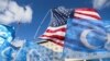 Flags fly during a rally for the Uyghur people of China in Washington on Nov. 28, 2022. The U.S. added more China-based companies to a blacklist on Aug. 1, 2023, barring their goods from entering the United States as a measure against forced labor.