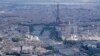 The Seine rivers flows though Paris, with the Eiffel Tower at center, in Paris, Tuesday, July 11, 2023. Heavy rains in Paris have dealt a blow to plans intended to test the readiness for swimmers to race in the River Seine at next year's Summer Olympics.