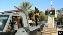 Libyan security forces stand guard in Tripoli, Libya, Aug. 16, 2023. 