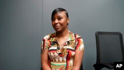 Porcha Woodruff poses in Oak Park, Michigan, Aug. 7, 2023. Woodruff, who was falsely accused of a carjacking, is suing the city of Detroit due to what she says is an overreliance on facial recognition technology. 