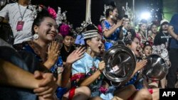 This photo taken July 31, 2023, shows supporters cheering for their village team during the final of the grassroots basketball competition CunBA in Taipan village, Taijiang county, in southwestern China's Guizhou province. 