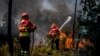 Firefighters battle a wildfire in Carrascal, Proenca a Nova on Aug. 6, 2023. More than 1,000 firefighters battled a wildfire in Portugal as officials warned that thousands of hectares were at risk amid soaring temperatures across the country. 