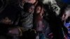 Children rest in a hut on the side of the road crowded with some 140 people in Niamey, Niger, July 31, 2023. 
