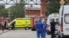 Ambulances are seen near the Zagorsk Optical-Mechanical Plant following a blast on its territory, in Sergiev Posad in the Moscow Region, Russia, Aug. 9, 2023. 