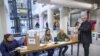 This handout picture released by the Argentinian Presidency shows President Alberto Fernandez casting his vote during primary elections at a polling station in Buenos Aires, Aug. 13, 2023. (Photo by Esteban Collazo / Argentinian Presidency / AFP)