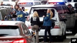 Members of the ATF and FBI arrive at Fort Lauderdale–Hollywood International Airport, Jan. 6, 2017, in Fort Lauderdale, Fla. A gunman opened fire in the baggage claim area at the airport Friday, killing five people and wounding others before being taken into custody.