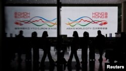 FILE - Travelers at Hong Kong International Airport after the lifting of coronavirus disease (COVID-19) movement controls in Hong Kong, China, Dec. 14, 2022.