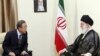 In this photo released by an official website of the Iranian supreme leader's office, U.N. Secretary-General Ban Ki-Moon, left, meets with Iranian supreme leader Ayatollah Ali Khamenei, under a portrait of late revolutionary founder Ayatollah Khomeini, in