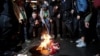 Following President-elect Donald Trump's election victory, protesters burn a U.S. flag outside Trump Tower in New York, Nov. 9, 2016.