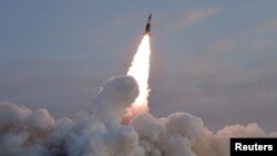FILE PHOTO: A tactical guided missile is launched, according to state media, at an undisclosed location in North Korea