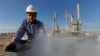 In this photo from February 2011, an employee works at an oil refinery in eastern Libya, where support for federalism is growing.