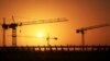 Cranes operate at the site of the football stadium in Benghazi, Libya, Jan. 19, 2013.
