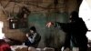 Jihadist fighters from the Jabhat al-Nusra group take up positions in Aleppo during a battle against Syrian government forces December 24m 2012. Al-Nusra fighters are also accused of clashes with other anti-govrnment rebels. 