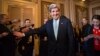 Senator John Kerry emerges after a unanimous vote by the Senate Foreign Relations Committee approving him to become America's next top diplomat, January 29, 2013. 