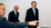 U.N. Secretary-General Ban Ki-moon (R) and Organisation for the Prohibition of Chemical Weapons (OPCW) Director-General Ahmet Uzumcu (C) arrive at a news conference at the OPCW in the Hague Apr. 8, 2013.