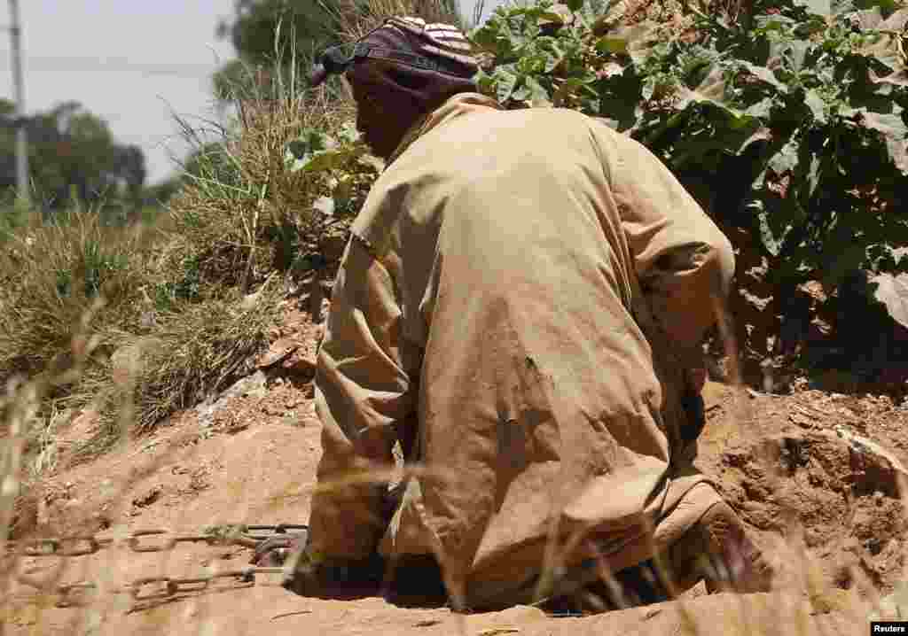 South African authorities said 22 gold miners who came out of a disused and temporarily blocked shaft, near Johannesburg over the last two days have been arrested and will be charged with illegal mining, Feb. 17, 2014.