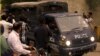 Pakistani police drive men accused of child abuse to the Lahore High Court in Pakistan, August 11, 2015.