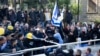 Right wing supporters of Israeli solider, Sgt. Elor Azaria, scuffle outside a Israeli military court in Tel Aviv, Israel, Jan. 4, 2017. Scuffles erupted outside the court during the proceedings.