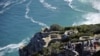 Tourists enjoy the view from Cape Point on the southern tip of the Cape Peninsula, about 50 kilometers south of Cape Town, South Africa, on May 2010.