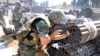 Forces loyal to Syrian President Bashar Assad take their position during a clashes against rebels, Aleppo, Syria, May 26, 2013. (SANA). 