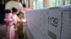 FILE: A Cambodian women is checking her name on the voter list at a polling station in Phnom Penh, Cambodia, June 2017. (Hean Socheata/VOA Khmer)