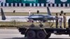 FILE - Pakistan's first locally manufactured armed drone aircraft is loaded on a vehicle during the Pakistan National Day parade in Islamabad, Pakistan, March 23, 2015.