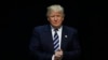 FILE - President-elect Donald Trump arrives to speak to supporters during a rally, in Grand Rapids, Mich., Dec. 9, 2016. 