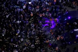Catalan pro-independence demonstrators pack the street in Barcelona, Spain, Oct. 19, 2019. Barcelona and the rest of the restive Spanish region of Catalonia are reeling from five straight days of violent protests.