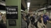 Passengers exit a subway train at New York's Times Square station, Nov. 1, 2012. 