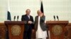 FILE - Afghan President Ashraf Ghani, right, shakes hands with Pakistani Prime Minster Nawaz Sharif during a joint press conference at the presidential palace in Kabul, Afghanistan, May 12, 2015. 