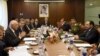 Afghan Foreign Minister Salahuddin Rabbani, right, talks with Pakistan's National Security Adviser Sartaj Aziz, left, during their meeting in Islamabad, Pakistan, Aug. 13, 2015. 