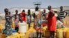 FILE - Residents of a camp for the internally-displaced line up to get water from a borehole, on the outskirts of the capital Juba, South Sudan, Jan. 22, 2019. 