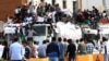 Libyan protesters hold placards and banners during a demonstration in support of the "political isolation law" in Libya's landmark Martyrs Square on May 5, 2013 in Tripoli, Libya. 