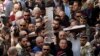 Christian faithful carry a cross during Good Friday in Jerusalem, March 25, 2016. 