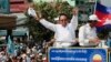 FILE - In this June 2, 2017, file photo, opposition party Cambodia National Rescue Party (CNRP) leader Kem Sokha greets his supporters at a rally in Phnom Penh. The European Union said Tuesday it has suspended assistance to Cambodia’s election commission following last month’s dissolution of the country’s main opposition party and warned that next July’s general election will not be legitimate if the opposition is not allowed to participate. (AP Photo/Heng Sinith, File)