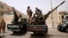 Libyan militias blockade the Justice Ministry in Tripoli April 30 demanding the ouster of officials linked to the late Moammar Gadhafi.