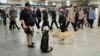 Police officers and their dogs on duty in Penn Station, April 16, 2013 in New York City