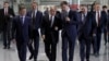 Russian President Vladimir Putin, center, visits a new power plant in Crimea, part of Moscow's efforts to upgrade the region's infrastructure in Sevastopol, Crimea, March 18, 2019. 