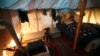 Syrian refugee children sit inside their tent at a small refugee camp, in Ketermaya village southeast of Beirut, Lebanon, March 14, 2013.