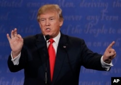 FILE - Republican presidential nominee Donald Trump during the third presidential debate with Democratic presidential nominee Hillary Clinton at UNLV in Las Vegas, Oct. 19, 2016.
