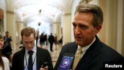 FILE - Senator Jeff Flake (R-AZ) speaks to reporters on Capitol Hill in Washington, Jan. 22, 2018.