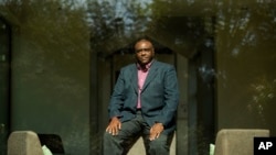 FILE - Former Congolese Vice President Jean-Pierre Bemba poses for a photograph after being interviewed by The Associated Press in Waterloo, Belgium, Sept. 11, 2018. 