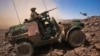 A French soldier stands guard in an armoured vehicle in the Terz valley, about 60 km (37 miles) south of the town of Tessalit in northern Mali March 21, 2013. 