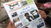 FILE - An Afghan man reads a local newspaper carrying a headline about the new leader of the Afghan Taliban, Mullah Akhtar Mansoor, in Kabul, Afghanistan, Aug. 1, 2015.