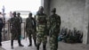 M23 rebels guard weapons given to them by the government's army in Goma November 21, 2012. 