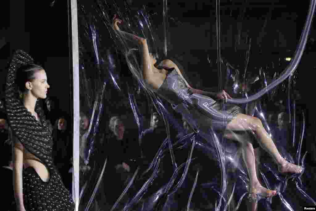 A model presents a creation of designer Iris van Herpen as part of her Fall/Winter 2014-2015 women's ready-to-wear collection during Paris Fashion Week, France.