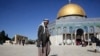 FILE - A Palestinian walks in front of the Dome of the Rock ahead of the prayers in Jerusalem, Dec. 8, 2017.