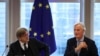 The European Union's Chief Brexit Negotiator Michel Barnier, right, and Guy Verhofstadt, the European Parliament’s Brexit steering group coordinator, attend a Brexit meeting at the European Parliament in Brussels, Belgium, Oct. 2, 2019.